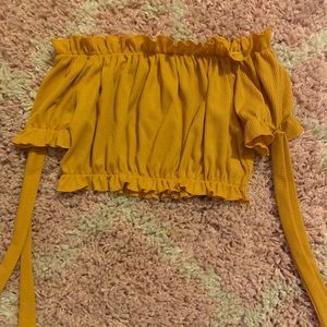 yellow shoulder top from pretty little thing.